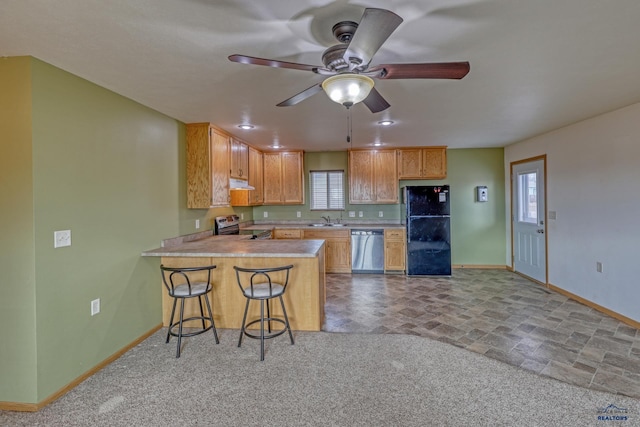 kitchen with kitchen peninsula, stainless steel appliances, plenty of natural light, and sink