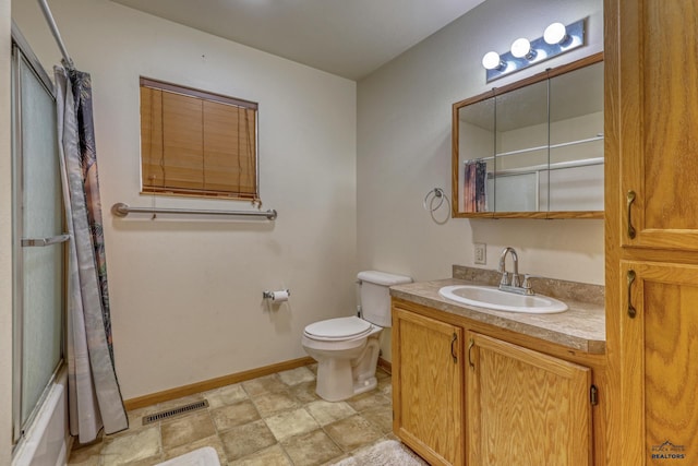 full bathroom with vanity, shower / bath combination with curtain, and toilet