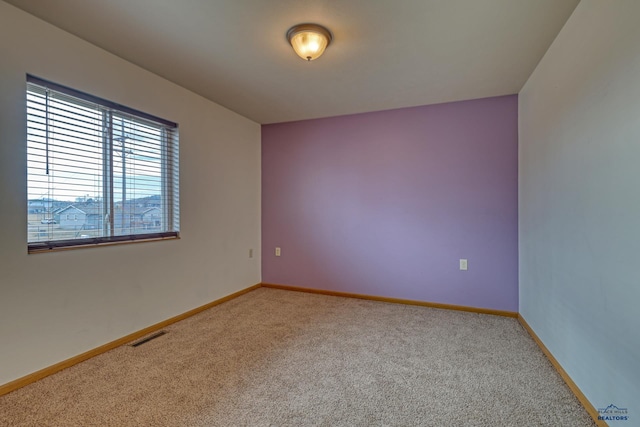 empty room with carpet flooring