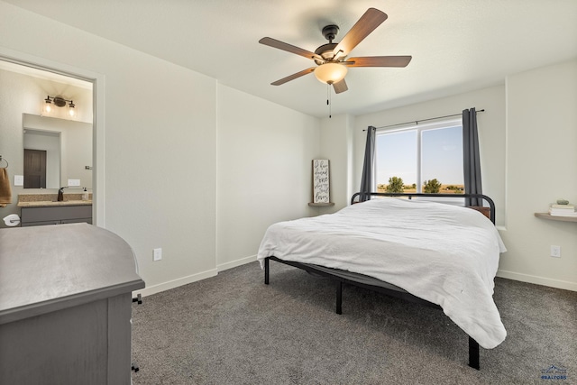 carpeted bedroom with connected bathroom, ceiling fan, and sink