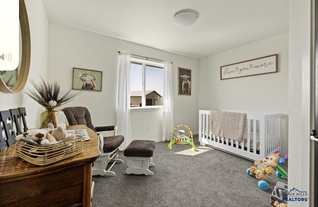 carpeted bedroom featuring a crib