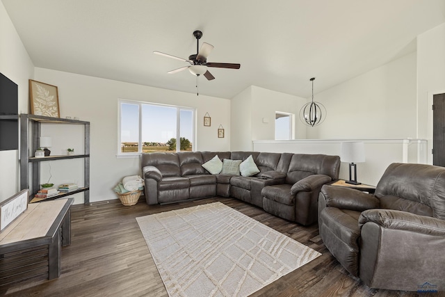 living room with ceiling fan, lofted ceiling, and dark wood-type flooring