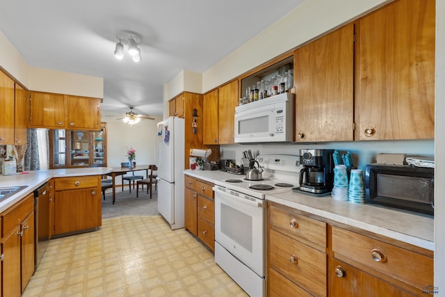 kitchen featuring ceiling fan and white appliances