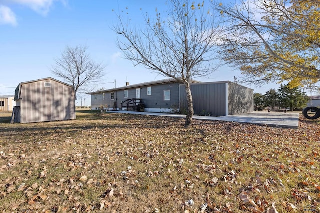 view of property exterior with a storage shed