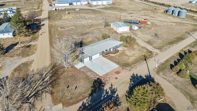 birds eye view of property with a rural view