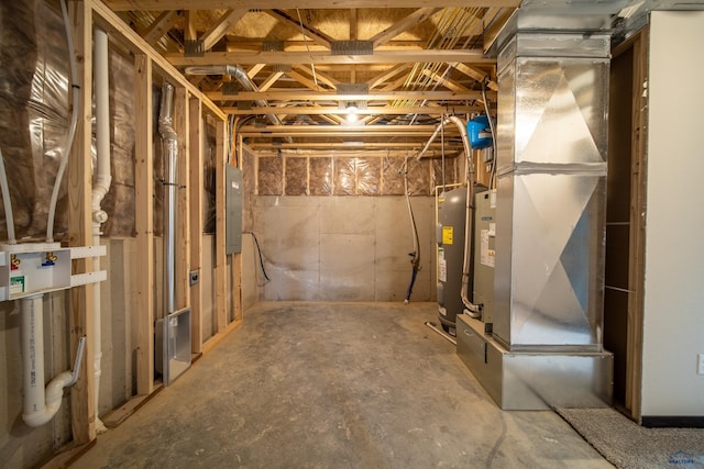 basement featuring water heater and electric panel