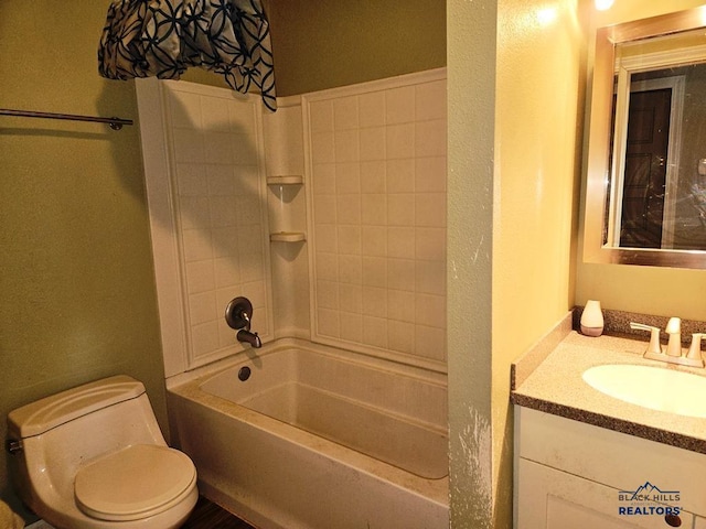 full bathroom featuring bathing tub / shower combination, vanity, and toilet