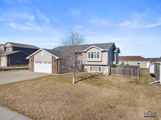 view of front facade with a front yard and a garage