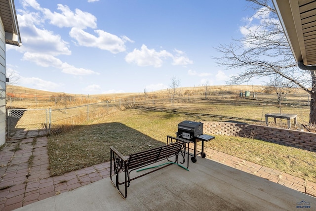 view of patio / terrace featuring a rural view and grilling area