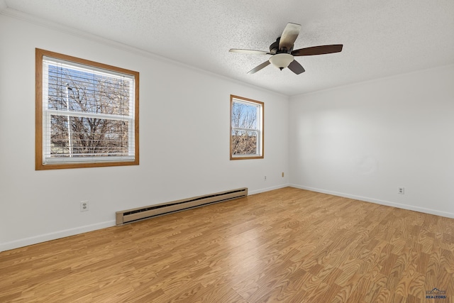 unfurnished room with ceiling fan, light hardwood / wood-style floors, a textured ceiling, and a baseboard heating unit