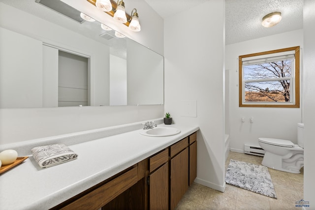 bathroom featuring a baseboard heating unit, tile patterned floors, a textured ceiling, toilet, and vanity