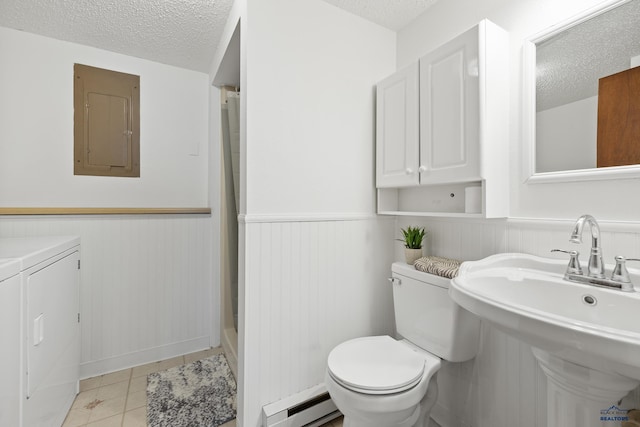 bathroom with sink, a baseboard radiator, independent washer and dryer, electric panel, and a textured ceiling