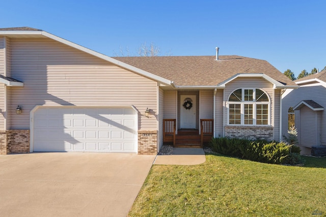 ranch-style home featuring a front yard and a garage