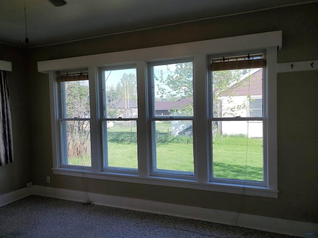 interior space with plenty of natural light and carpet floors