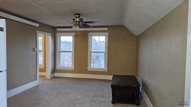 bonus room featuring ceiling fan, carpet, and vaulted ceiling