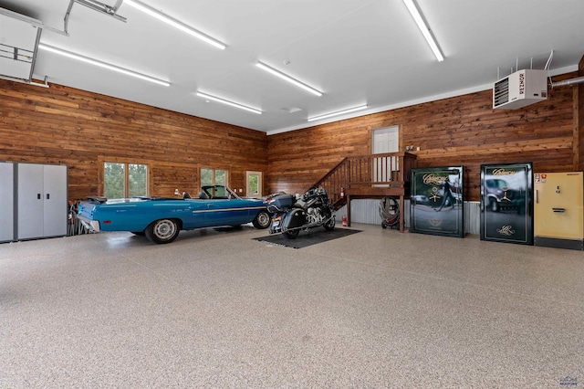 garage featuring wooden walls