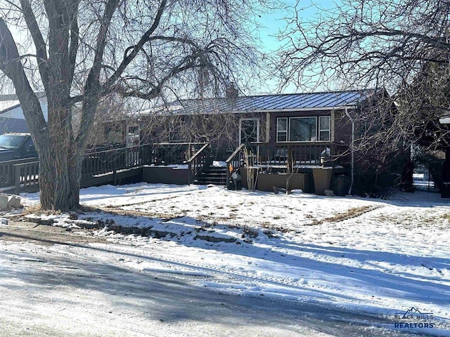 view of front of house featuring a wooden deck