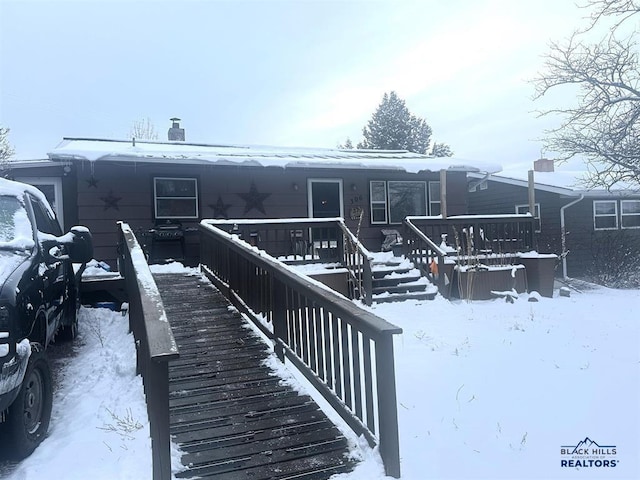 view of snow covered house