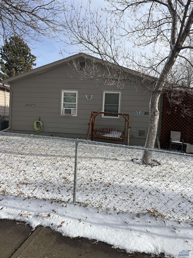 view of snow covered house