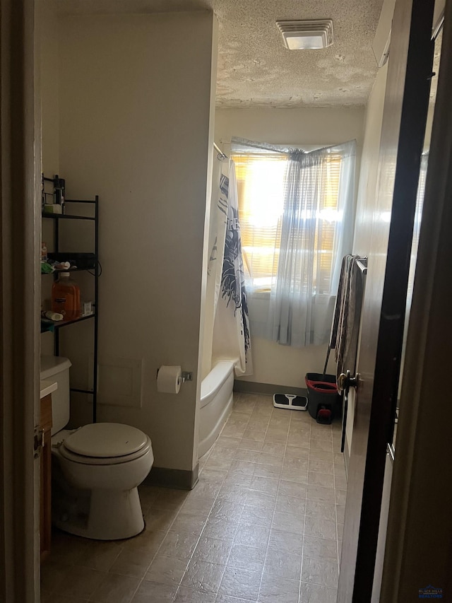 810 Blaine Ave, Rapid City, SD 57701 - bathroom with a textured ceiling, toilet, and shower / bathtub combination with curtain