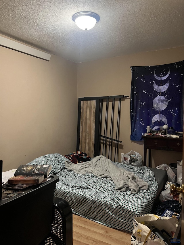 810 Blaine Ave, Rapid City, SD 57701 - bedroom featuring wood-type flooring and a textured ceiling