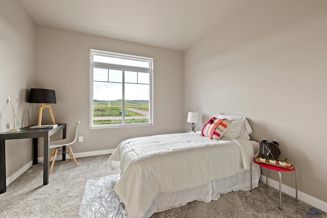 bedroom featuring carpet floors and lofted ceiling