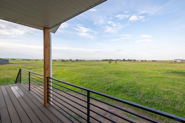 wooden deck featuring a rural view