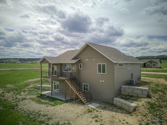 back of house featuring a yard and a patio area