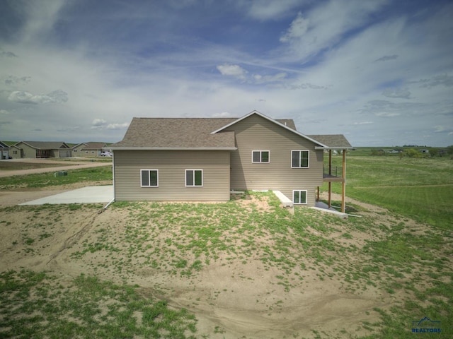 rear view of house featuring a patio