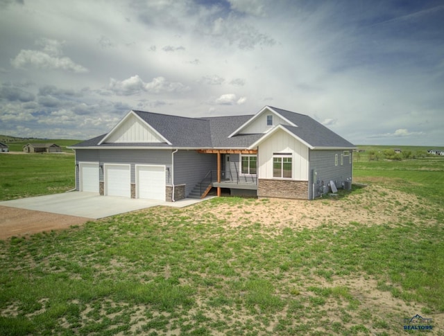 single story home with a garage and a front lawn