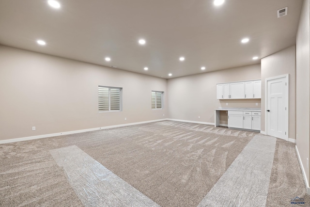 living room featuring light colored carpet