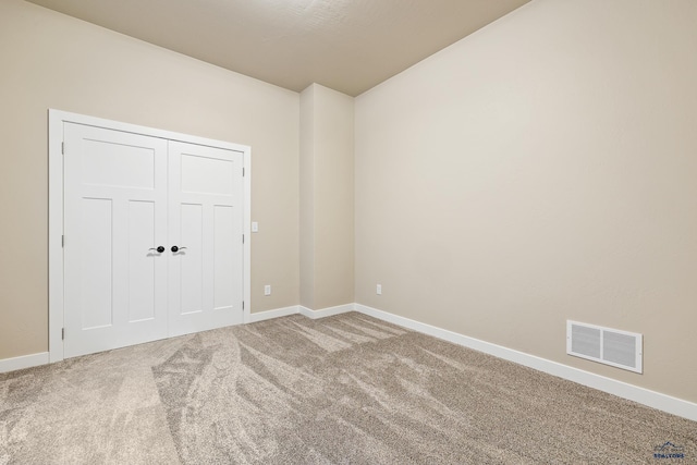 empty room with carpet flooring