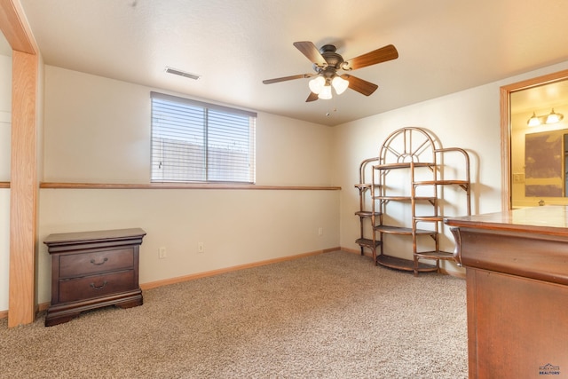 miscellaneous room with light colored carpet and ceiling fan