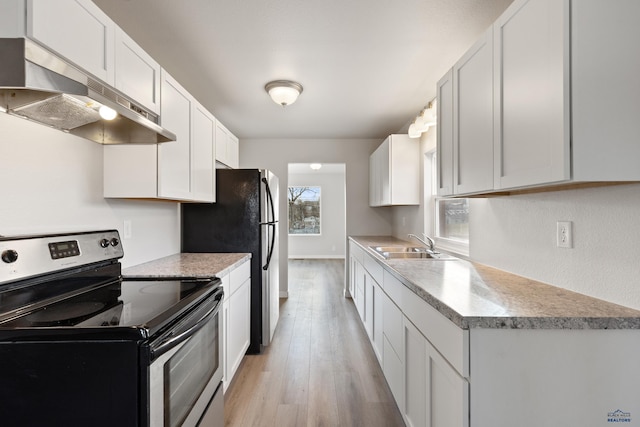 kitchen with white cabinetry, electric range, light hardwood / wood-style flooring, and sink