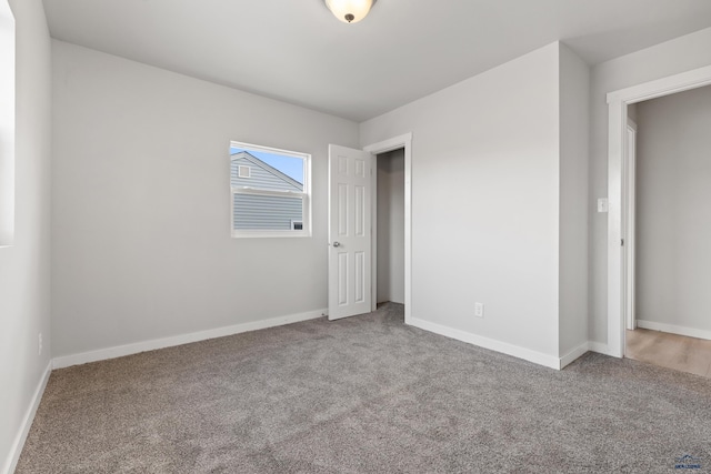 unfurnished bedroom featuring carpet