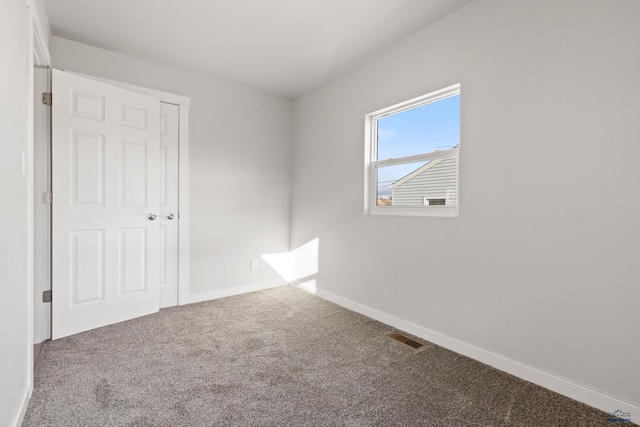 empty room featuring carpet