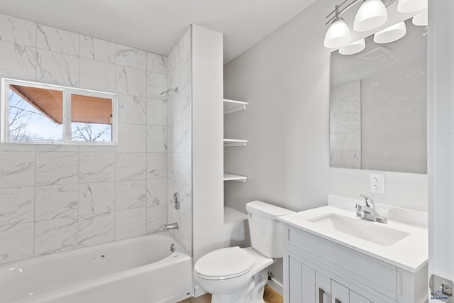 full bathroom featuring toilet, vanity, and tiled shower / bath