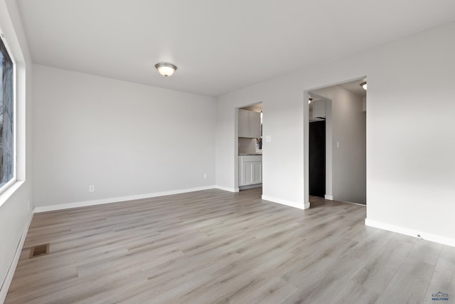 empty room featuring light hardwood / wood-style floors