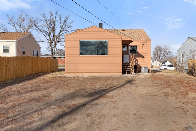 back of house featuring central air condition unit