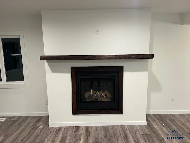 6920 Long View Rd, Rapid City, SD 57703 - detailed view of wood finished floors and a fireplace