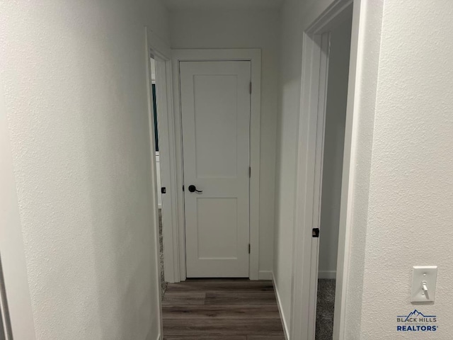 6920 Long View Rd, Rapid City, SD 57703 - hallway with wood finished floors and a textured wall