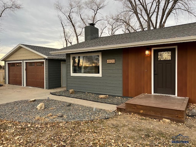 6920 Long View Rd, Rapid City, SD 57703 - single story home featuring a chimney, roof with shingles, and driveway