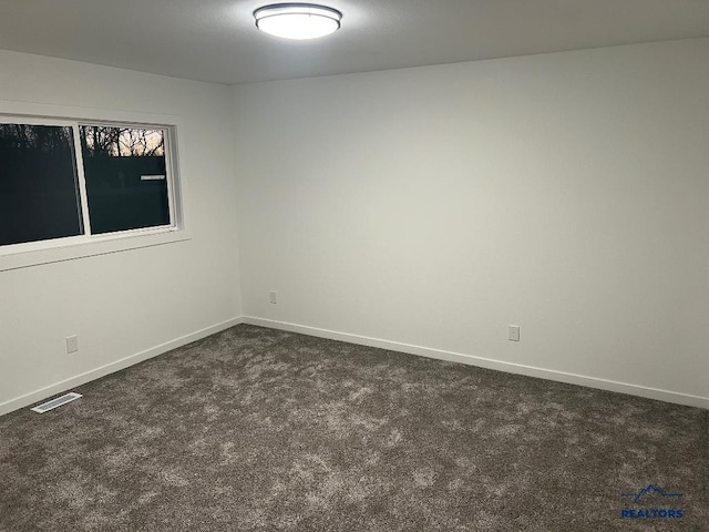6920 Long View Rd, Rapid City, SD 57703 - empty room featuring dark colored carpet and baseboards