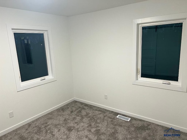 6920 Long View Rd, Rapid City, SD 57703 - empty room with dark colored carpet and baseboards