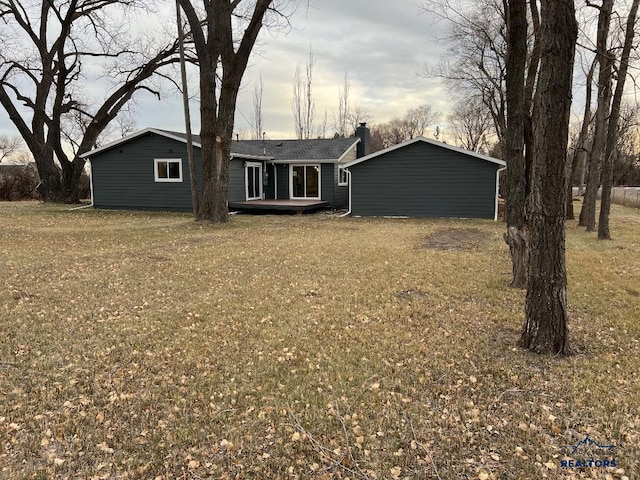 6920 Long View Rd, Rapid City, SD 57703 - back of house featuring a lawn and a chimney