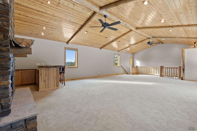 bonus room featuring light carpet, plenty of natural light, and wood ceiling