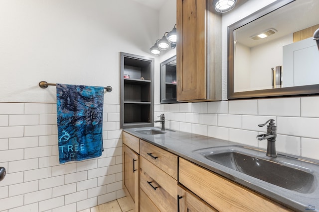 bathroom with tile patterned floors, vanity, and tile walls