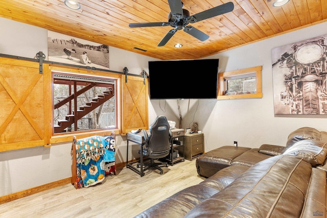 living room with light wood-type flooring, a barn door, ceiling fan, and wooden ceiling