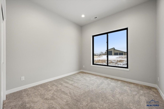 view of carpeted spare room