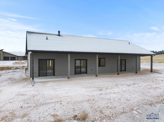 back of property with a patio area